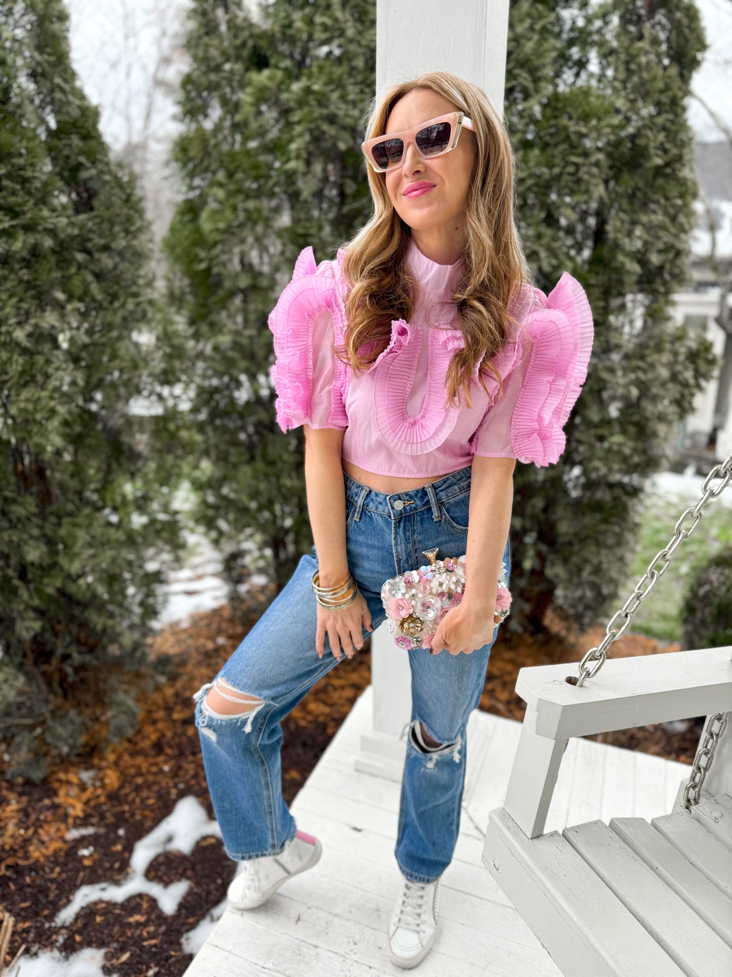 woman standing on porch wearing lilac Circled Ruffles Detail Chiffon Cropped Short Sleeve Top  with jeans and sneakers