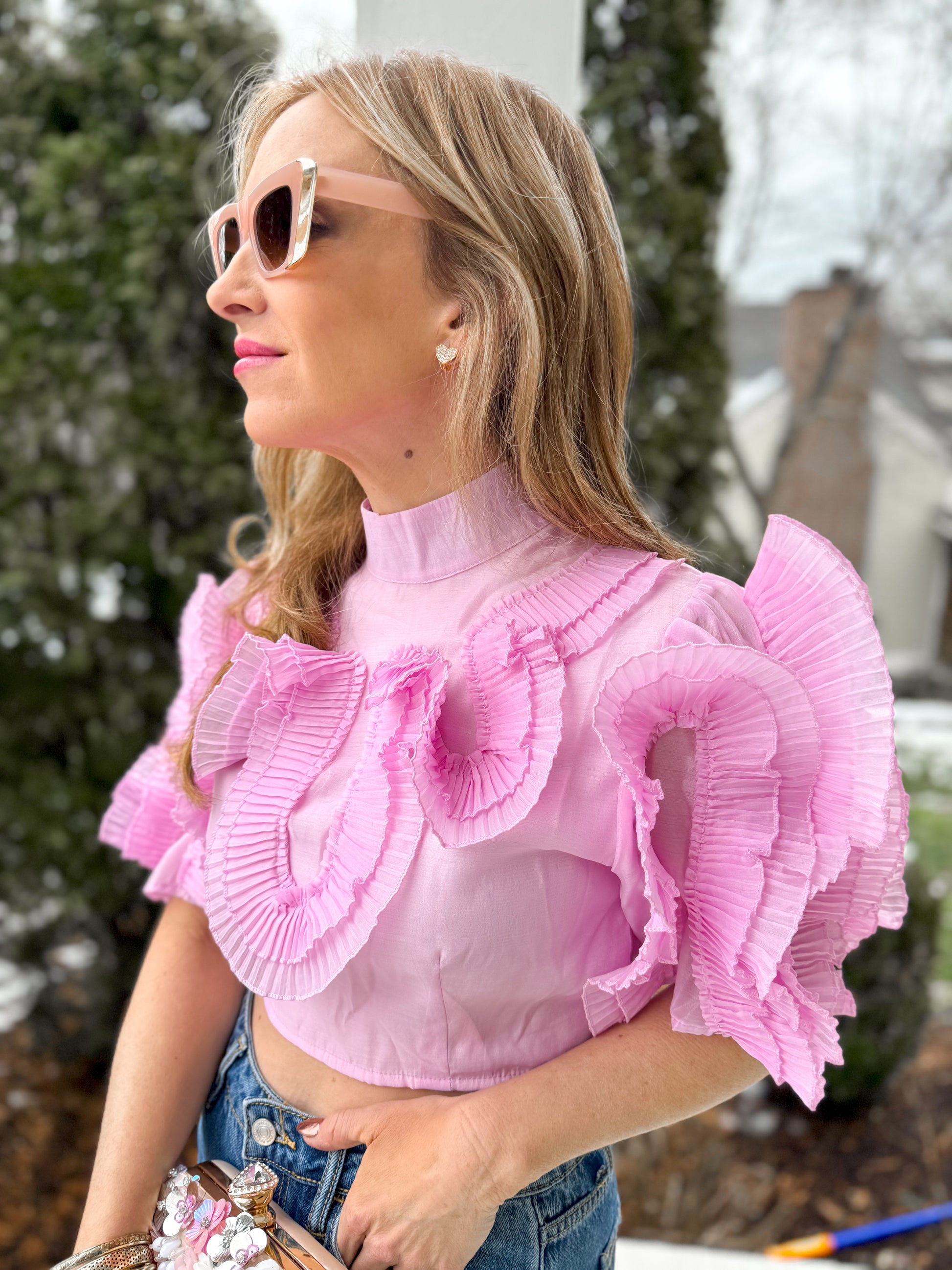 closeup front/side view of woman wearing lilac Circled Ruffles Detail Chiffon Cropped Short Sleeve Top with jeans 