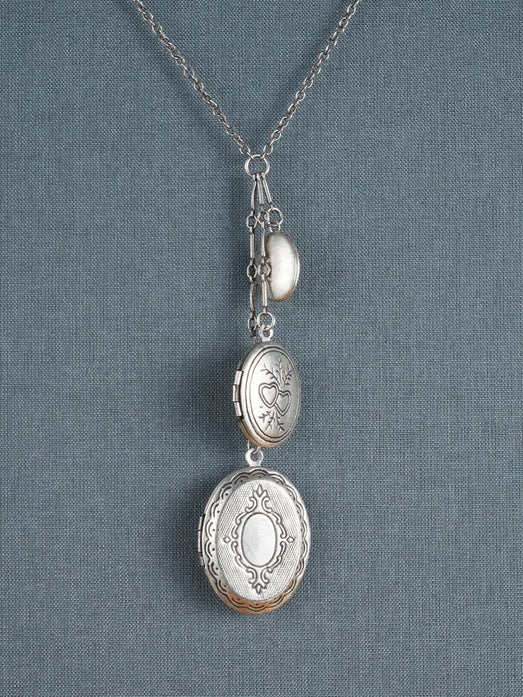 necklace with 3 lockets of varying size in silver