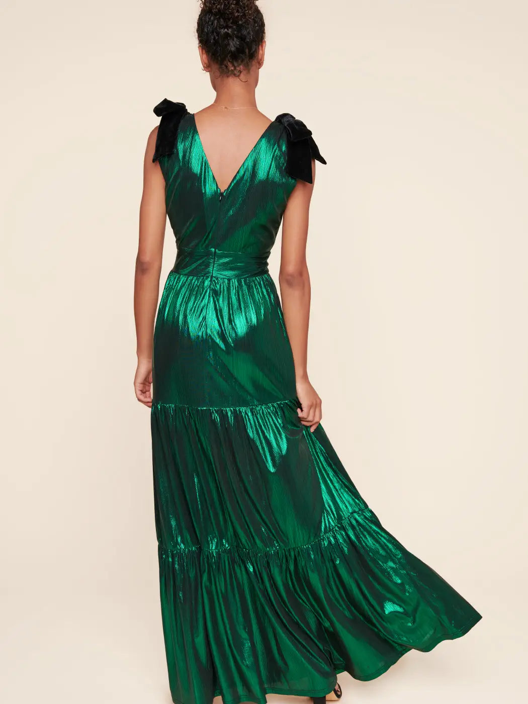 back view of Liquid Satin Evening Maxi Dress in emerald with black velvet bows on the sleeves