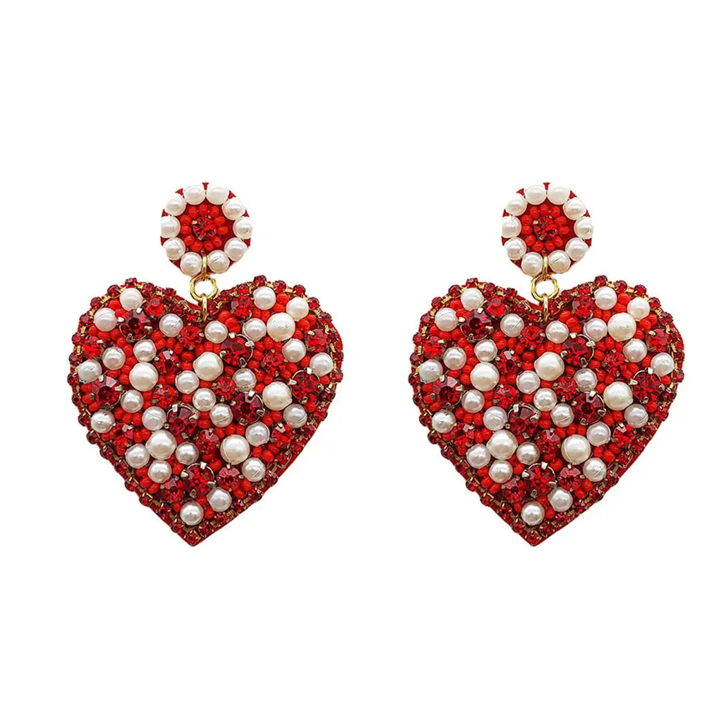 A pair of Beaded Heart Mixed Red Rhinestone and Pearl Earrings for Valentine's day on a white background